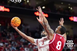 Nebraska Cornhuskers guard Brice Williams (3) puts up a lay up against Indiana Hoosiers forward Bryson Tucker (8) in the first half during a college basketball game Friday, December 13, 2024 in Lincoln, Nebraska. Photo by Jaelle Johnson.