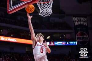 Nebraska Cornhuskers guard Connor Essegian (0) makes a layup againt the North Florida Ospreys in the first half during a college basketball game Sunday, December 1, 2024, in Lincoln, Nebraska. Photo by John S. Peterson.