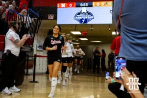 Nebraska Cornhuskers libero Lexi Rodriguez (8) leads the Huskers out to take on the Florida A&M Rattlers during the first round of the NCAA volleyball tournament Friday, December 6, 2024, in Lincoln, Nebraska. Photo by John S. Peterson.