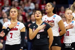 Nebraska Cornhuskers libero Lexi Rodriguez (8) singing along to the National Anthem before taking on the Miami Hurricanes during the second round of the NCAA volleyball tournament Saturday, December 7, 2024, in Lincoln, Nebraska. Photo by John S. Peterson.