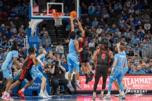 Creighton Bluejays Jasen Green blocks a shot against St John's Red Storm during a college basketball game Tuesday, December 31, 2024, in Omaha, Nebraska. Photo by Brandon Tiedemann.