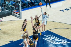 Creighton Bluejays Kiani Lockett shoots a floater during a college basketball game against the Wyoming Cowgirls on December 17th, 2024 in Omaha Nebraska. Photo by Brandon Tiedemann.