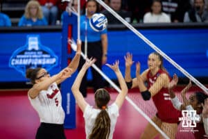 Nebraska Cornhuskers setter Bergen Reilly (2) sets the ball for Rebekah Allick against the Wisconsin Badgers in the first set during the final regional match in the NCAA championship Sunday, December 15, 2024, in Lincoln, Nebraska. Photo by John S. Peterson.