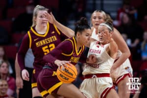 Nebraska Cornhuskers guard Callin Hake (14) gets pushed down by Minnesota Golden Gophers guard Tori McKinney (14) in the first halfi during a college basketball game Sunday, December 8, 2024, in Lincoln, Nebraska. Photo by John S. Peterson.