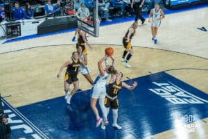 Creighton Bluejays Morgan Maly attempts a shot after a foul during a college basketball game against the Wyoming Cowgirls on December 17th, 2024 in Omaha Nebraska. Photo by Brandon Tiedemann.