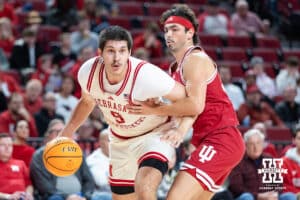 Nebraska Cornhuskers forward Berke Buyuktuncel (9) dribbles the ball against Indiana Hoosiers guard Trey Galloway (32) in the first half during a college basketball game Friday, December 13, 2024 in Lincoln, Nebraska. Photo by Jaelle Johnson.