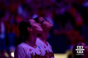 Nebraska Cornhuskers setter Bergen Reilly (2) and middle blocker Rebekah Allick (5) watching the hype video before taking on the Florida A&M Rattlers during the first round of the NCAA volleyball tournament Friday, December 6, 2024, in Lincoln, Nebraska. Photo by John S. Peterson.