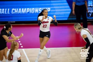 Nebraska Cornhuskers outside hitter Harper Murray (27) celebrates a kill against the Wisconsin Badgers in the first set during the final regional match in the NCAA championship Sunday, December 15, 2024, in Lincoln, Nebraska. Photo by John S. Peterson.