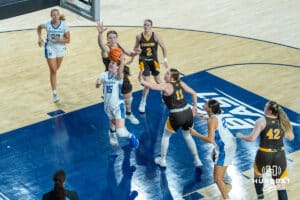 Creighton Bluejays Lauren Jensen shoots a layup during a college basketball game against the Wyoming Cowgirls on December 17th, 2024 in Omaha Nebraska. Photo by Brandon Tiedemann.