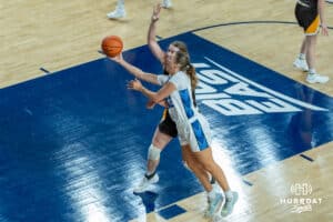 Creighton Bluejays Brooke Littrell attempts a layup during a college basketball game against the Wyoming Cowgirls on December 17th, 2024 in Omaha Nebraska. Photo by Brandon Tiedemann.