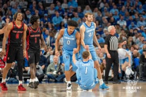 Creighton Bluejays Jasen Green and Isaac Traudt help Steven Ashworth up during a college basketball game against St John's Red Storm on Tuesday, December 31, 2024, in Omaha, Nebraska. Photo by Brandon Tiedemann.