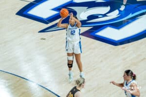 Creighton Bluejays Jayme Horan shoots a three pointer during a college basketball game against the Wyoming Cowgirls on December 17th, 2024 in Omaha Nebraska. Photo by Brandon Tiedemann.