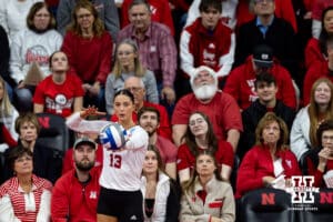 Nebraska Cornhuskers outside hitter Merritt Beason (13) prepares to serve the ball against the Florida A&M Rattlers in the first set during the first round of the NCAA volleyball tournament Friday, December 6, 2024, in Lincoln, Nebraska. Photo by John S. Peterson.