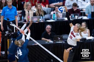 Nebraska Cornhuskers middle blocker Andi Jackson (15) spikes the ball against the Penn State Nittany Lions during the semi-final round in the NCAA championship Thursday, December 19, 2024, in Louisville, Kentucky. Photo by John S. Peterson.