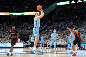 Creighton Bluejays Isaac Traudt shoots a wide open three pointer against St John's Red Storm during a college basketball game Tuesday, December 31, 2024, in Omaha, Nebraska. Photo by Brandon Tiedemann.