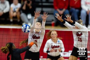 Nebraska Cornhuskers setter Bergen Reilly (2) and middle blocker Andi Jackson (15) block a spike from Florida A&M Rattlers in the first set during the first round of the NCAA volleyball tournament Friday, December 6, 2024, in Lincoln, Nebraska. Photo by John S. Peterson.