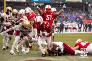 Nebraska Cornhuskers running back Rahmir Johnson (14) scores a touchdown against Boston College Eagles defensive lineman Kwan Williams (55) during the Pinstripe Bowl game, Saturday, December 28, 2024, in New York, New York. Photo by John S. Peterson.