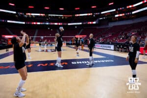 Nebraska Cornhuskers warm up during practice at the NCAA championships Wednesday, December 18, 2024, in Louisville, Kentucky. Photo by John S. Peterson.