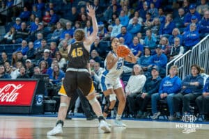 Creighton Bluejays Jayme Horan shoots a three pointer during a college basketball game against the Wyoming Cowgirls on December 17th, 2024 in Omaha Nebraska. Photo by Brandon Tiedemann.