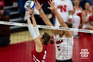 Nebraska Cornhuskers middle blocker Rebekah Allick (5) guards against Wisconsin Badgers setter Charlie Fuerbringer (24) in the first set during the final regional match in the NCAA championship Sunday, December 15, 2024, in Lincoln, Nebraska. Photo by John S. Peterson.