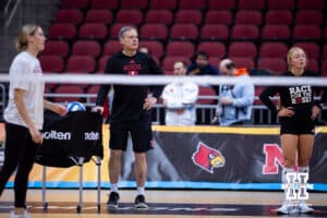 Nebraska Cornhuskers head coach John Cook watching warm-up during practice at the NCAA championships Wednesday, December 18, 2024, in Louisville, Kentucky. Photo by John S. Peterson.