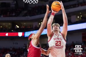 Nebraska Cornhuskers forward Andrew Morgan (23) makes a lay up against Indiana Hoosiers guard Trey Galloway (32) in the second half during a college basketball game Friday, December 13, 2024 in Lincoln, Nebraska. Photo by Jaelle Johnson.