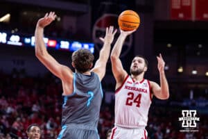 Nebraska Cornhuskers guard Rollie Worster (24) makes a jump shot against North Florida Ospreys guard Nate Lliteras (2) in the first half during a college basketball game Sunday, December 1, 2024, in Lincoln, Nebraska. Photo by John S. Peterson.