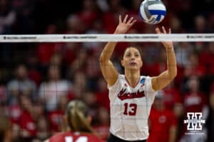 Nebraska Cornhuskers outside hitter Merritt Beason (13) hits the ball over the net against the Wisconsin Badgers in the second set during the final regional match in the NCAA championship Sunday, December 15, 2024, in Lincoln, Nebraska. Photo by John S. Peterson.