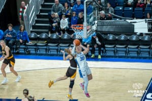 Creighton Bluejays Morgan Maly attempts a layup during a college basketball game against the Wyoming Cowgirls on December 17th, 2024 in Omaha Nebraska. Photo by Brandon Tiedemann.