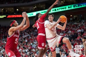 Nebraska Cornhuskers forward Berke Buyuktuncel (9) looks to pass against Indiana Hoosiers forward Mackenzie Mgbako (21) in the second half during a college basketball game Friday, December 13, 2024 in Lincoln, Nebraska. Photo by Jaelle Johnson.