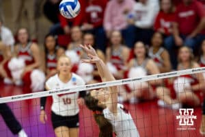 Nebraska Cornhuskers setter Bergen Reilly (2) sets the ball behind her against the Wisconsin Badgers in the second set during the final regional match in the NCAA championship Sunday, December 15, 2024, in Lincoln, Nebraska. Photo by John S. Peterson.