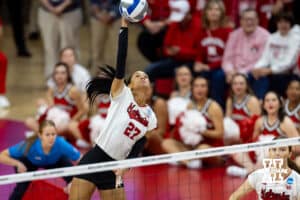 Nebraska Cornhuskers outside hitter Harper Murray (27) spikes the ball against the Wisconsin Badgers during the final regional match in the NCAA championship Sunday, December 15, 2024, in Lincoln, Nebraska. Photo by John S. Peterson.