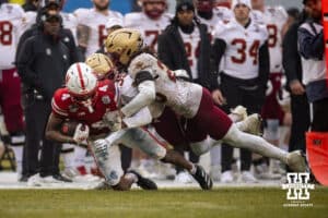 Nebraska Cornhuskers running back Rahmir Johnson (14) is tackled by Boston College Eagles defensive back Ashton McShane (35) and defensive back KP Price (20) during the Pinstripe Bowl game, Saturday, December 28, 2024, in New York, New York. Photo by John S. Peterson.