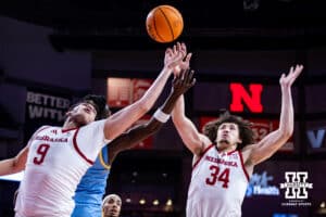 Nebraska Cornhuskers center Braxton Meah (34) and Berke Buyuktuncel reach for the rebound against the Southern University Jaguars in the first half during college basketball game, Monday, December 30, 2024, in Lincoln, Nebraska. Photo by John S. Peterson.