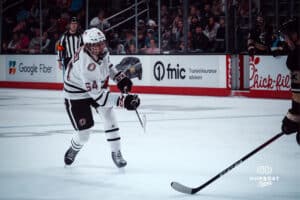 UNO Mavericks player, Isaiah Norlin, makes his way to the goal during a college hockey game on Dec 29, 2024 in Omaha, Nebraska. Photo by Logan Hock