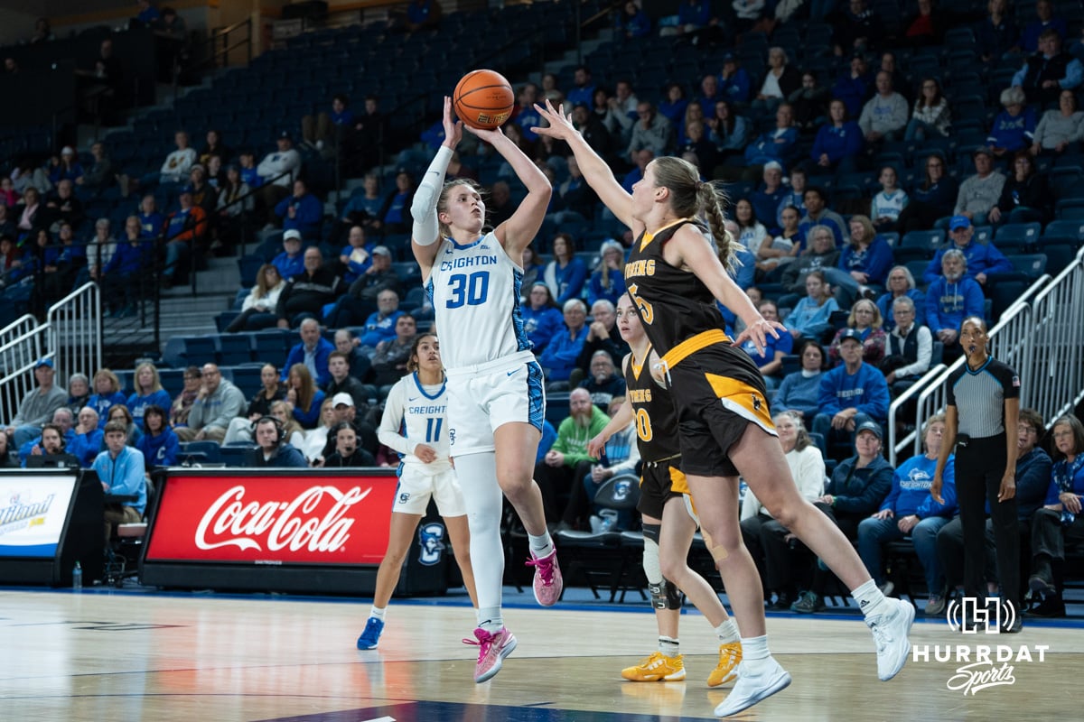 Creighton Bluejays Morgan Maly shoots a reverse jumper during a college basketball game against the Wyoming Cowgirls on December 17th, 2024 in Omaha Nebraska. Photo by Brandon Tiedemann.