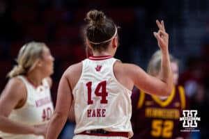 Nebraska Cornhuskers guard Callin Hake (14) signals making a three point shot against Minnesota Golden Gophers during a college basketball game Sunday, December 8, 2024, in Lincoln, Nebraska. Photo by John S. Peterson.