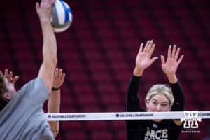 Nebraska Cornhuskers middle blocker Andi Jackson works on blocking during practice at the NCAA championships Wednesday, December 18, 2024, in Louisville, Kentucky. Photo by John S. Peterson.