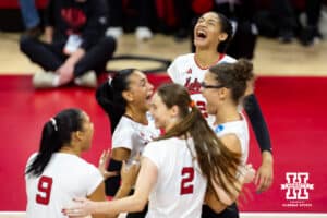 Nebraska Cornhuskers outside hitter Taylor Landfair (12) celebrates with her teammates against the Wisconsin Badgers during the final regional match in the NCAA championship Sunday, December 15, 2024, in Lincoln, Nebraska. Photo by John S. Peterson.