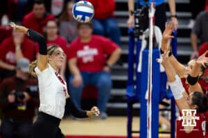 Nebraska Cornhuskers middle blocker Andi Jackson (15) spikes the ball against Wisconsin Badgers in the second set during the final regional match in the NCAA championship Sunday, December 15, 2024, in Lincoln, Nebraska. Photo by John S. Peterson.