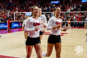 Nebraska Cornhuskers setter Bergen Reilly (2) and outside hitter Merritt Beason (13) head to the locker room after sweeping Florida A&M Rattlers during the first round of the NCAA volleyball tournament Friday, December 6, 2024, in Lincoln, Nebraska. Photo by John S. Peterson.