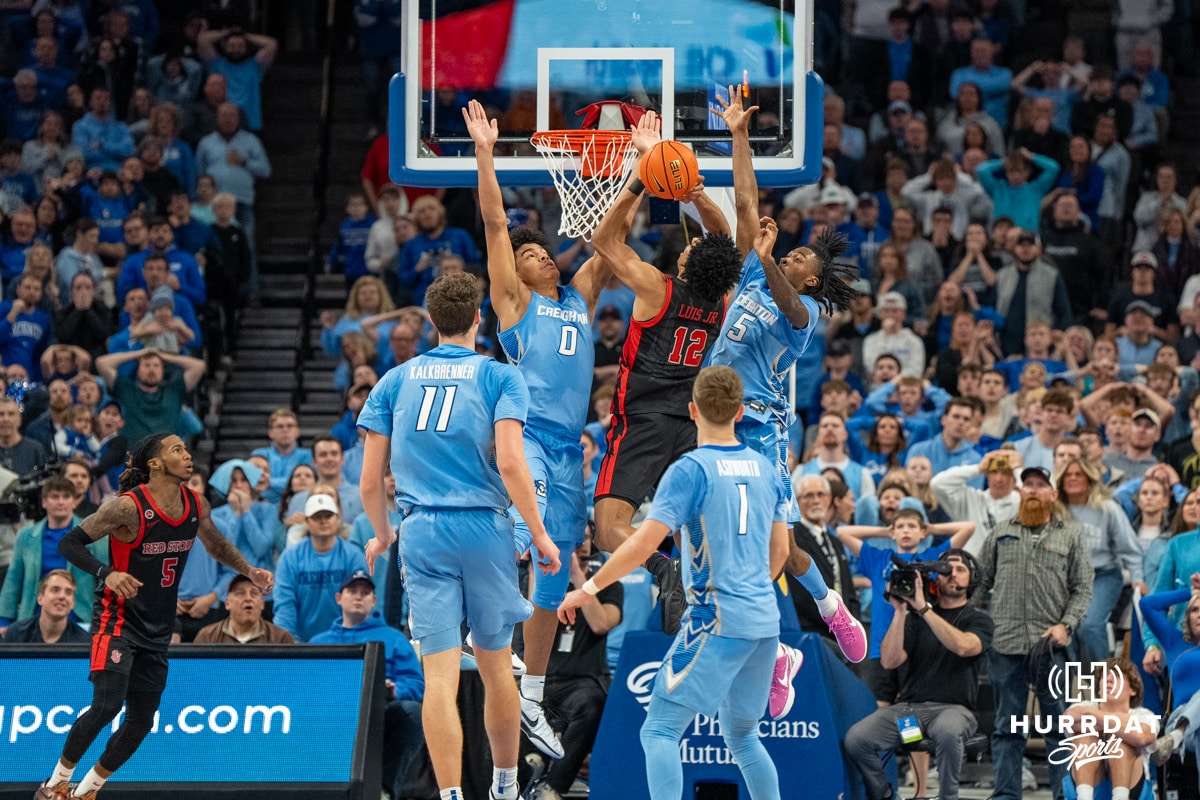 Creighton Bluejays Jasen Green and Jamiya Neal contest a shot against St John's Red Storm during a college basketball game Tuesday, December 31, 2024, in Omaha, Nebraska. Photo by Brandon Tiedemann.