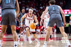 Nebraska Cornhuskers guard Sam Hoiberg (1) dribbles the ball against North Florida Ospreys guard Nate Lliteras (2) in the second half during a college basketball game Sunday, December 1, 2024, in Lincoln, Nebraska. Photo by John S. Peterson.