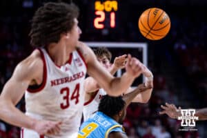 Nebraska Cornhuskers guard Connor Essegian (0) passes the ball to center Braxton Meah (34) in the second half during college basketball game, Monday, December 30, 2024, in Lincoln, Nebraska. Photo by John S. Peterson.