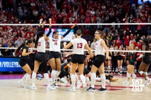 Nebraska Cornhuskers celebrate match point against the Miami Hurricanes during the second round of the NCAA volleyball tournament Saturday, December 7, 2024, in Lincoln, Nebraska. Photo by John S. Peterson.