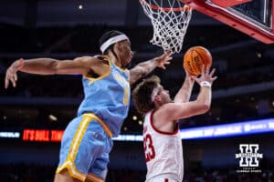 Nebraska Cornhuskers forward Andrew Morgan (23) makes a reverse layup against Southern University Jaguars forward DaMariee Jones (1) in the second half during college basketball game, Monday, December 30, 2024, in Lincoln, Nebraska. Photo by John S. Peterson.