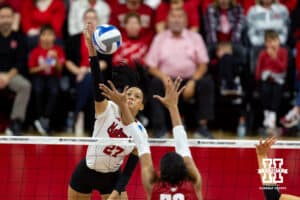 Nebraska Cornhuskers outside hitter Harper Murray (27) spikes the ball against the Wisconsin Badgers during the final regional match in the NCAA championship Sunday, December 15, 2024, in Lincoln, Nebraska. Photo by John S. Peterson.