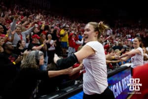 Nebraska Cornhuskers outside hitter Lindsay Krause (22) giving fives to all the fans after the win over the Wisconsin Badgers during the second regional match in the NCAA championship Sunday, December 15, 2024, in Lincoln, Nebraska. Photo by John S. Peterson.