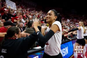 Nebraska Cornhuskers outside hitter Harper Murray (27) giving fives to all the fans after the win over the Wisconsin Badgers during the second regional match in the NCAA championship Sunday, December 15, 2024, in Lincoln, Nebraska. Photo by John S. Peterson.