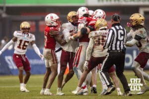 Nebraska Cornhuskers quarterback Dylan Raiola (15) confronts Boston College Eagles defensive back Carter Davis (28) when getting hit when sliding during the Pinstripe Bowl game, Saturday, December 28, 2024, in New York, New York. Photo by John S. Peterson.